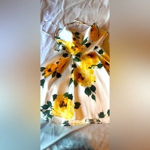 White dress with yellow flowers and a strap back